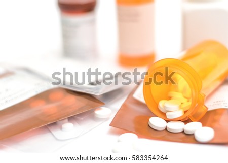 Prescription order from hospital doctor with medicines, drug in plastic zip bags and yellow bottle for chronic patient. Antibiotics , paracetamol, vitamins supplement dosage on white background.