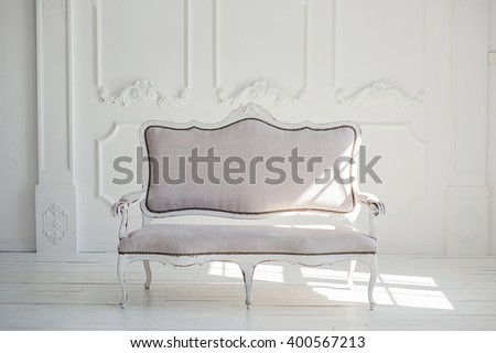 White textile classical style sofa in vintage room. White background.