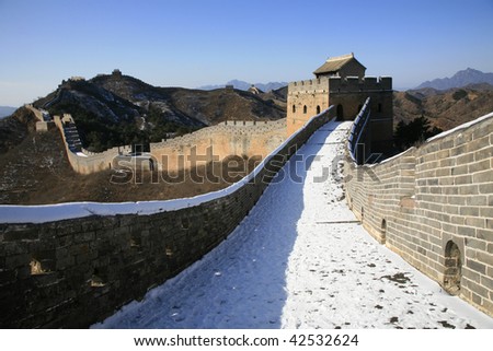 The Great Wall in winter covered with snow.