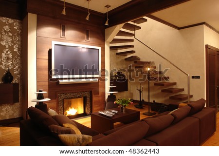 interior of a living room with fireplace and stair