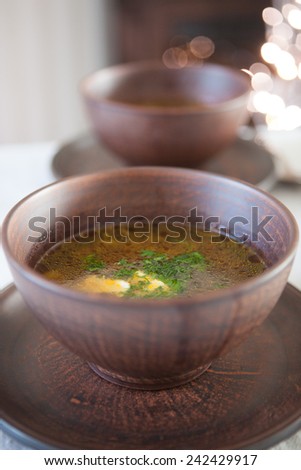 Close-up of two bronze bowl of mushroom soup