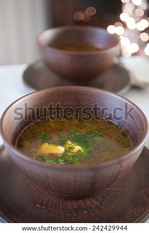 Close-up of two bronze bowl of mushroom soup