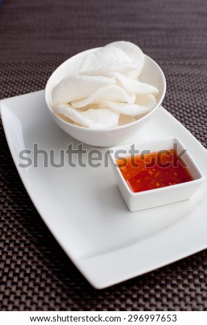 crisp rice, dish of crisp cracker with sauce