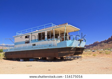 Rusty houseboat stranded in the desert near Moab, Utah