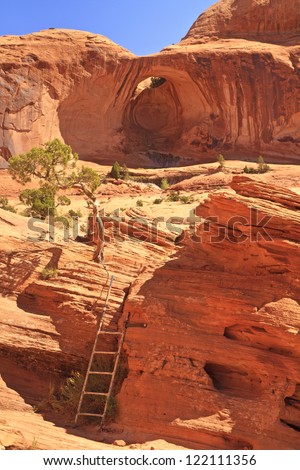 A ladder on the  trail to Corona Arch on the slickrock in front of Bow Tie Arch, a 