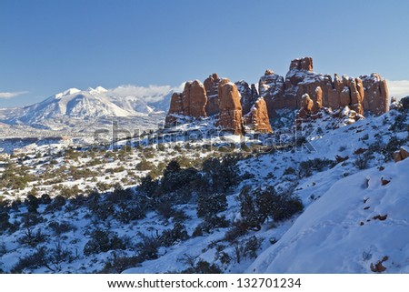 Snow-covered red rock fins in the Windows section of Arches National Park in Utah