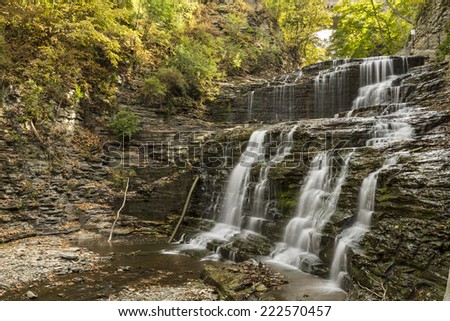 Mulit-tiered waterfall in Cascadilla Gorge on the Cornell Campus in Autumn in Ithaca, New York