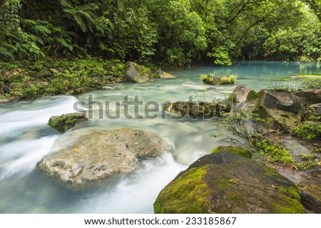 The cerulean blue waters of the \'Blue Lagoon\' on the Rio Celeste in Volcan Tenorio National Park, Costa Rica.