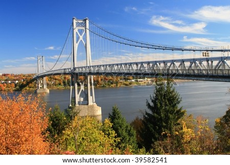 Mid Hudson Bridge at fall looking across the Hudson River from Highland to Poughkeepsie - New York