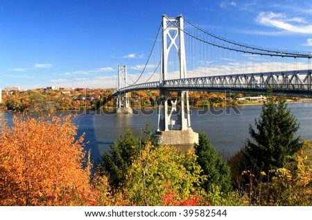 Mid Hudson Bridge at fall looking across the Hudson River from Highland to Poughkeepsie - New York