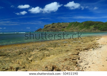 Exposed rocks and sand at low tide on Playa Escondido (Hidden Beach) near Faardo, Puerto Rico