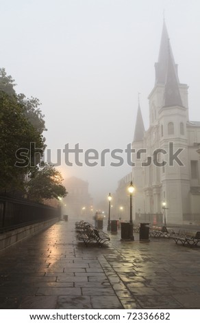 Early morning fog on Jackson square obscures St. Louis Cathedral in New Orleans, Louisiana
