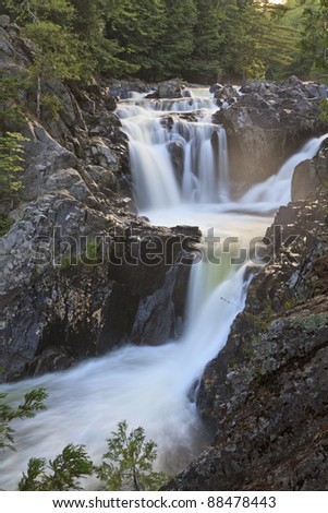 Late afternoon sun on the mist above Split Rock Falls in the Adirondack Mountains of New York