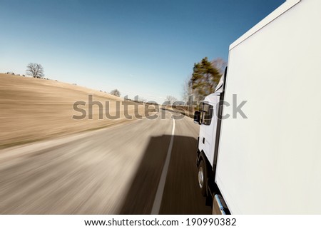 Truck on the road 3D render on photographic background Truck on the road 3D render on photographic background