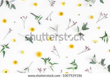 Flowers composition. Pattern made of yellow and pink flowers on white background. Flat lay, top view.