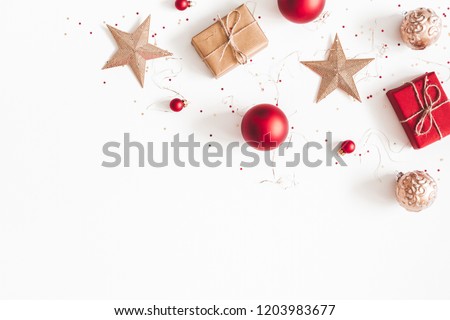 Christmas composition. Christmas gifts, red and golden decorations on white background. Flat lay, top view, copy space