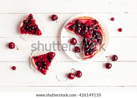 Dessert with red berries on wooden white background. Summer fruit dessert. Top view, flat lay