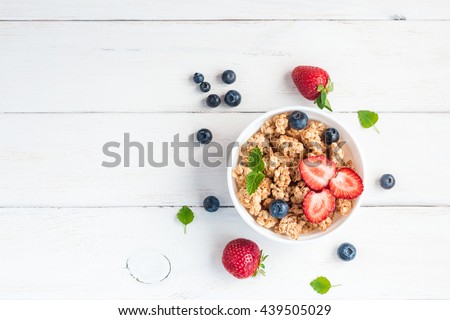 Cereal. Breakfast with muesli and berries. Top view, flat lay