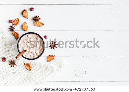 Autumn composition. Hot chocolate, knitted blanket and autumn leaves. Flat lay, top view