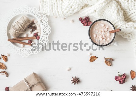 Autumn. Hot chocolate, knitted blanket, gift, dried flowers and autumn leaves. Flat lay, top view