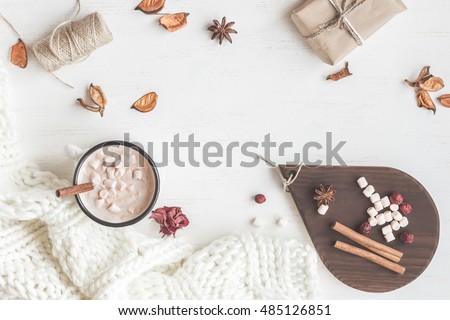 Fall. Hot chocolate, knitted blanket, gift, dried flowers and autumn leaves. Flat lay, top view