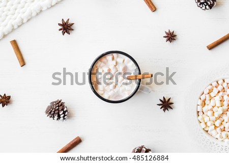 Christmas. Winter. Hot chocolate, cinnamon sticks, anise star, marshmallow, knitted blanket and cones. Christmas composition. Flat lay, top view
