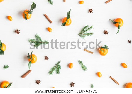 Christmas composition. Christmas frame with tangerines, fir branches, cinnamon sticks, anise star. Flat lay, top view