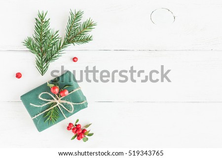 Christmas composition. Christmas gift, fir branches. Flat lay, top view
