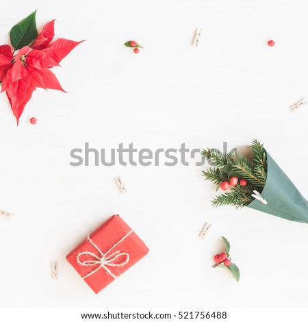 Christmas composition. Gift, bouquet made of traditional christmas plants. Flat lay, top view