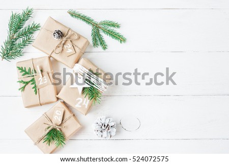 Christmas calendar. Christmas gift, fir branches, pine cones. Flat lay, top view.