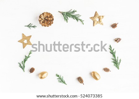 Christmas composition. Frame made of christmas decoration, cypress branches, pine cones. Flat lay, top view