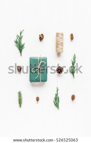 Christmas composition with pine cones, cypress branches, christmas gift. Top view, flat lay