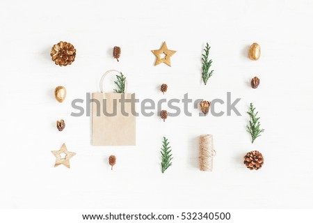 Christmas composition. Gift, christmas decoration, cypress branches, pine cones. Flat lay, top view.