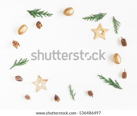 Christmas composition. Frame made of christmas decoration, cypress branches, pine cones. Flat lay, top view