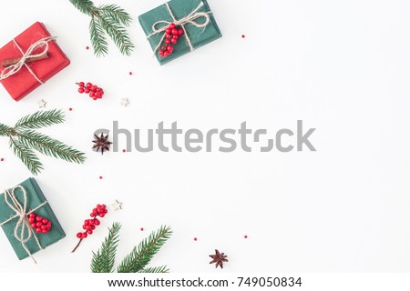 Christmas composition. Frame made of christmas gifts, pine branches, toys on white background. Flat lay, top view, copy space