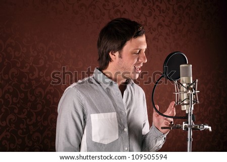 Pop singer singing a song in the recording Studio