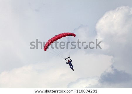 ZHUKOVSKY, RUSSIA - AUG 11: The opening ceremony of celebrating of the 100 anniversary of Russian air force of Russia. August, 11, 2012 at Zhukovsky, Russia. The paratroopers landing on the airfield