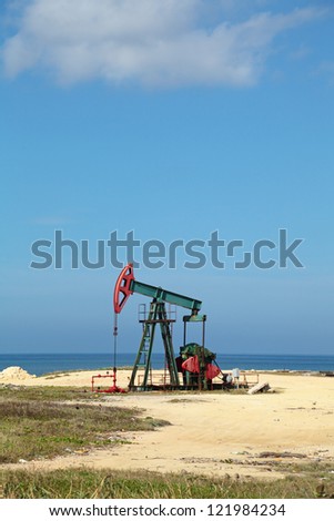 Oil pump on the shores of the Atlantic ocean, the Republic of Cuba