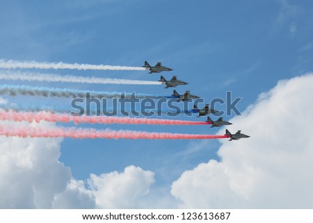 ZHUKOVSKY, RUSSIA - AUG 11: The opening ceremony of celebrating of the 100 anniversary of Russian air force. August, 11, 2012 at Zhukovsky, Russia. Group of aircraft smoke colors of the Russian flag