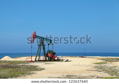 Oil pump on the shores of the Atlantic ocean, the Republic of Cuba