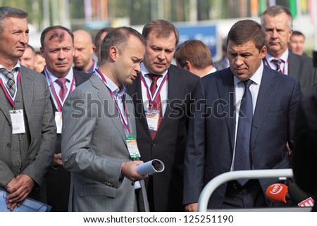 N.TAGIL, RUSSIA- AUG 22: Governor of Sverdlovsk region Evgeny Kuyvashev and Director Ural Works of Civil Aviation Vadim Badekha at RUSSIAN DEFENCE EXPO 2012 on August, 22, 2012 at Nizhny Tagil, Russia