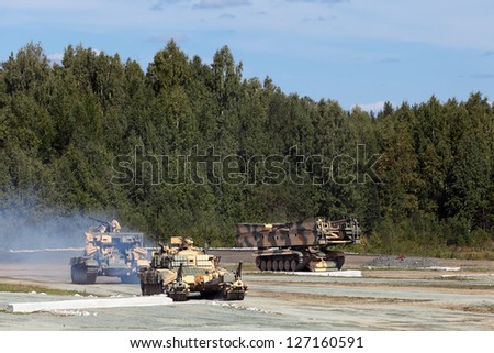NIZHNY TAGIL, RUSSIA- AUG 23: Engineering military vehicles at the firing range at the exhibition RUSSIAN DEFENCE EXPO 2012 on August, 23, 2012 in Nizhny Tagil, Russia