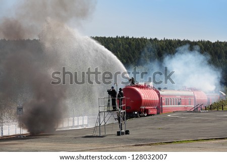 NIZHNY TAGIL, RUSSIA- AUG 23: The demonstration of functioning of fire trains at the exhibition RUSSIAN DEFENCE EXPO 2012 on August, 23, 2012 in Nizhny Tagil, Russia