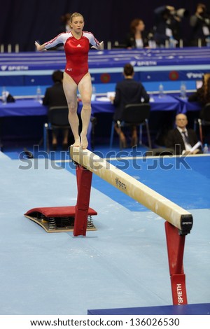 MOSCOW - APR 19: 2013 European Artistic Gymnastics Championships. Lisa Ecker - Austrian gymnast performs on the balance beam in Olympic Stadium on April 19, 2013 in Moscow, Russia.