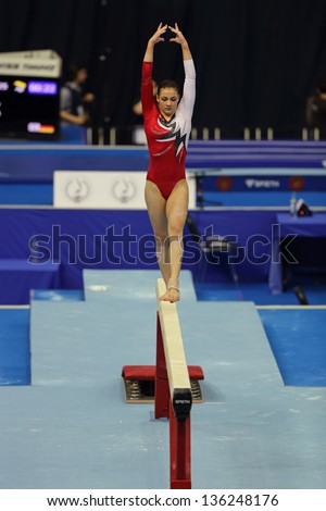 MOSCOW - APR 19: 2013 European Artistic Gymnastics Championships. Elisa Haemmerle - Austrian gymnast performs on the balance beam in Olympic Stadium on April 19, 2013 in Moscow, Russia.