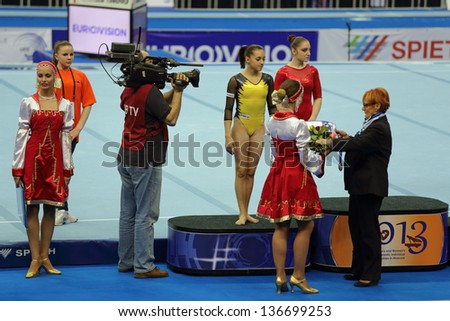 MOSCOW - APR 19: 2013 European Artistic Gymnastics Championships. Awarding of winners All-Around - Aliya Mustafina and Larisa Iordache in Olympic Stadium on April 19, 2013 in Moscow, Russia
