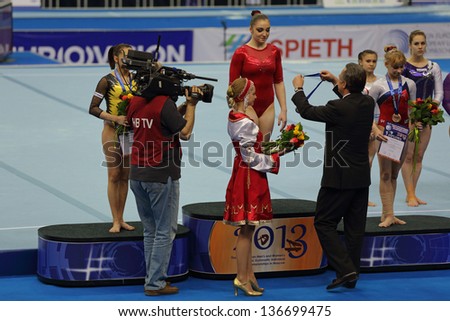 MOSCOW - APR 19: 2013 European Artistic Gymnastics Championships. Winners All-Around - Aliya Mustafina, Larisa Iordache and Anastasia Grishina  in Olympic Stadium on April 19, 2013 in Moscow, Russia