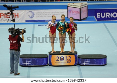 MOSCOW - APR 20: 2013 European Artistic Gymnastics Championships. Winners in Vault - Giulia Steingruber, Larisa Iordache and Noel van Klaveren in Olympic Stadium on April 20, 2013 in Moscow, Russia