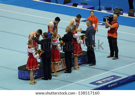 MOSCOW - APR 21: 2013 European Artistic Gymnastics Championships. Awarding of winners -  Emin Garibov, Sam Oldham  and Aleksandr Tsarevich in Olympic Stadium on April 21, 2013 in Moscow, Russia