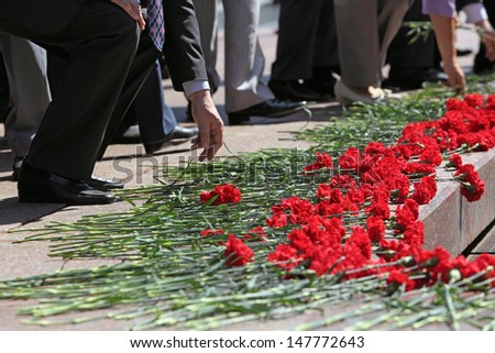 Moscow, Russia. People put flowers to the memorial Tomb of the Unknown Soldier. Events dedicated to the celebration of Victory Day (WWII)